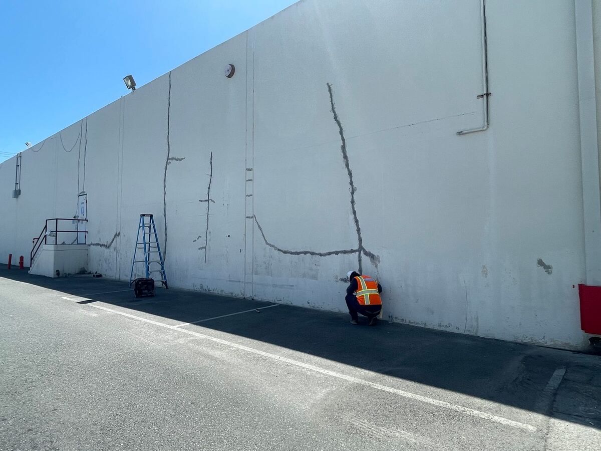 Routed and surface-sealed crack runs on a tilt-up wall