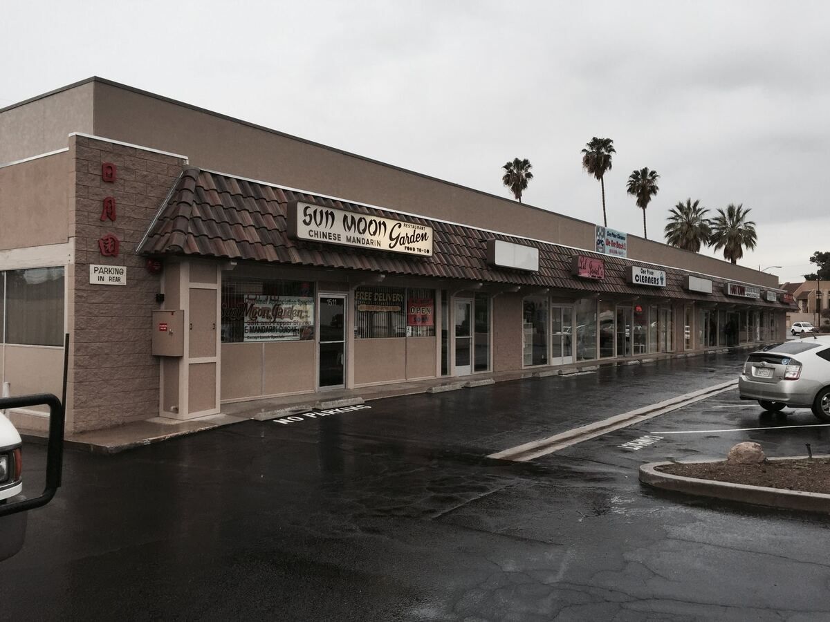 The restored Burbank Plaza storefronts after the fire rebuild, new roof tile and stucco, tenants back in