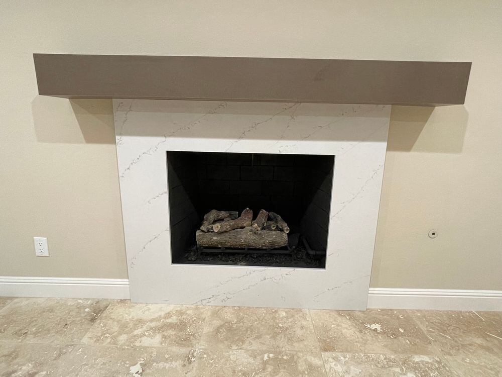Fireplace with quartz surround and custom mantle