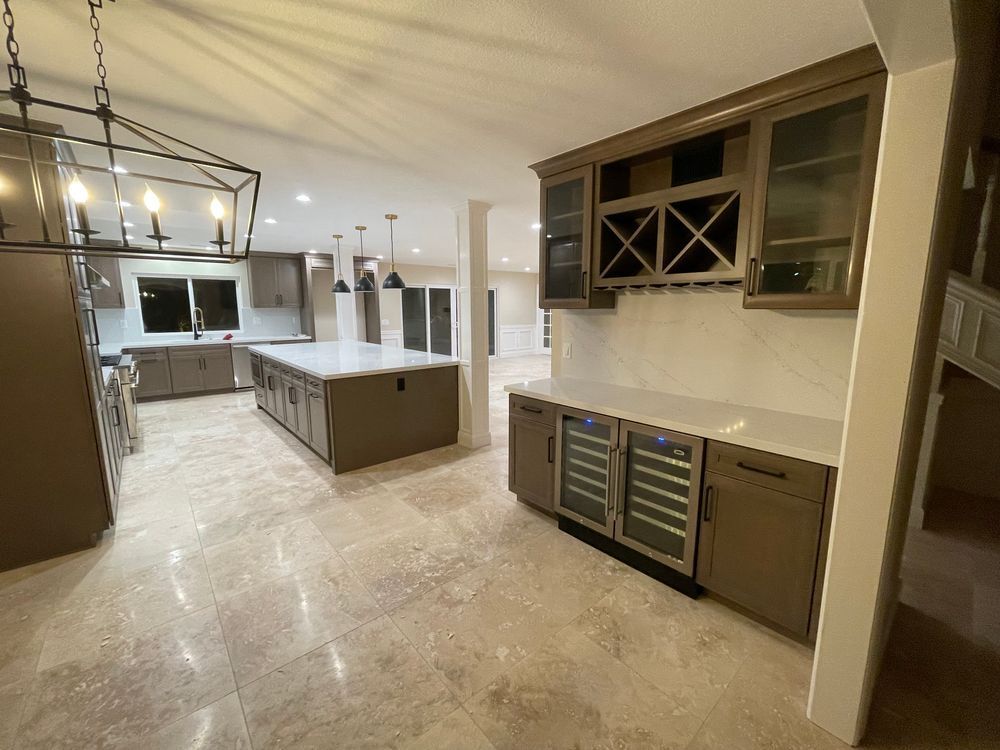 Open kitchen and custom wet bar with wine fridge