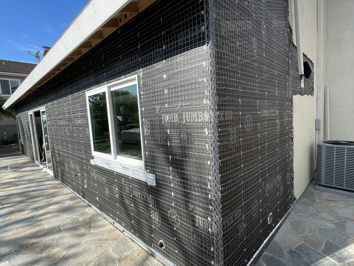 Addition exterior wrapped in building paper and wire lath, ready for stucco