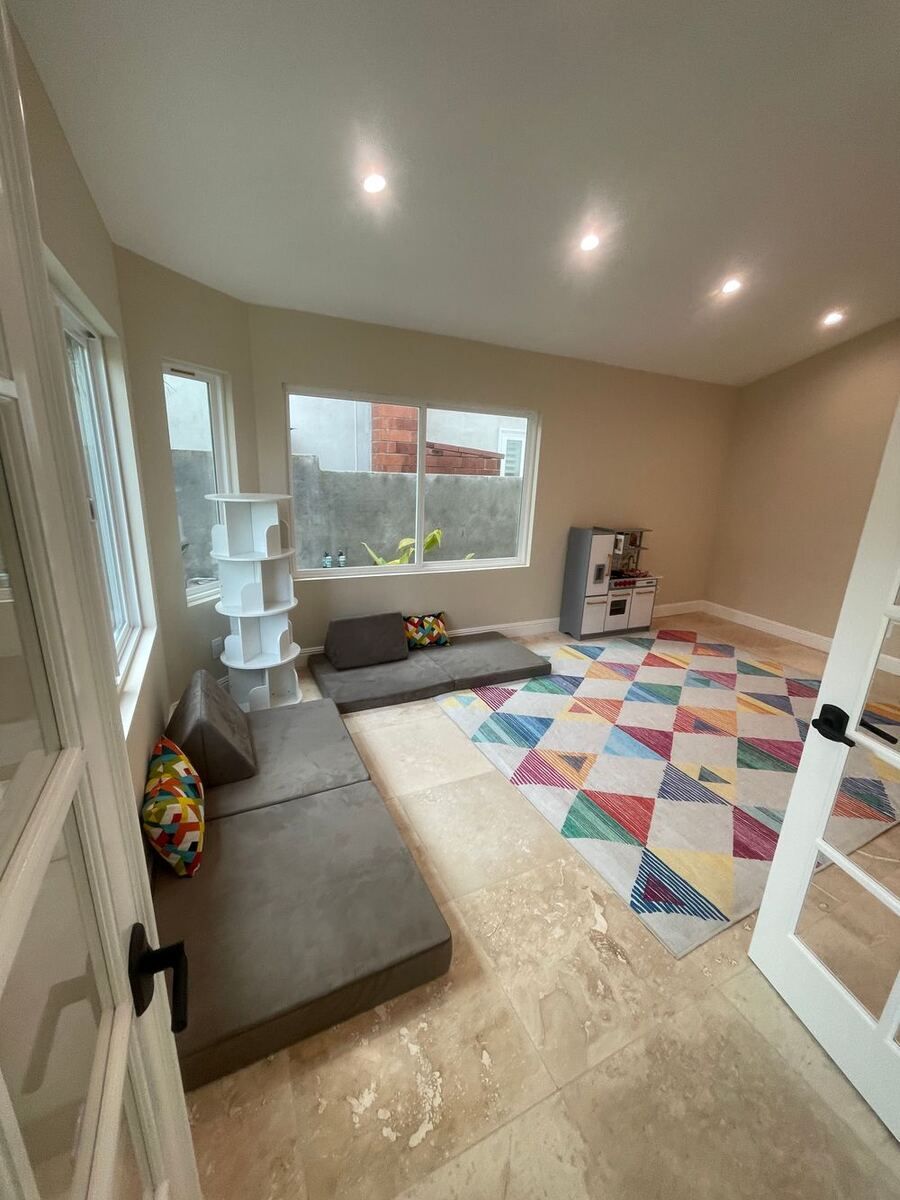Bright playroom addition with vaulted ceiling