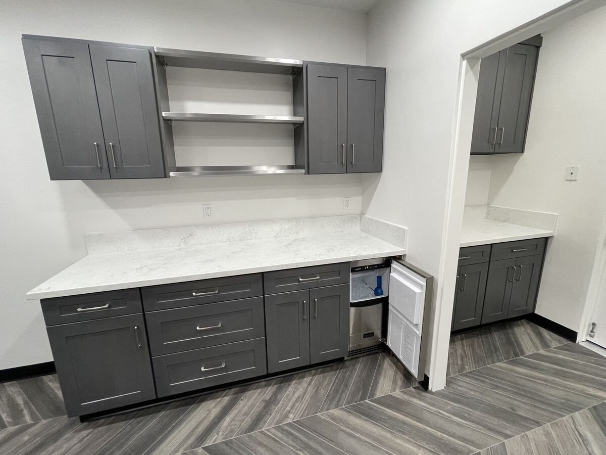Upper and lower cabinetry with open shelving