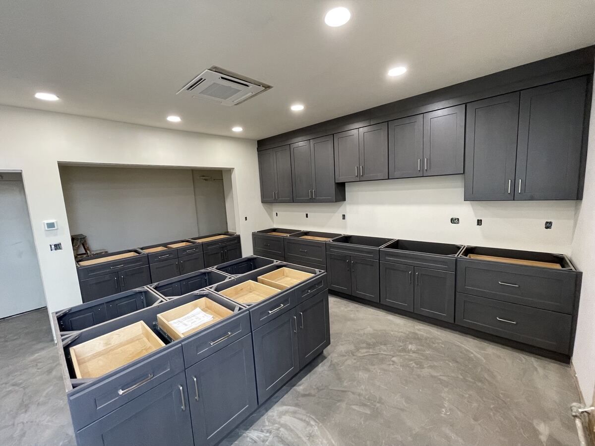 Cabinet boxes being set before counters
