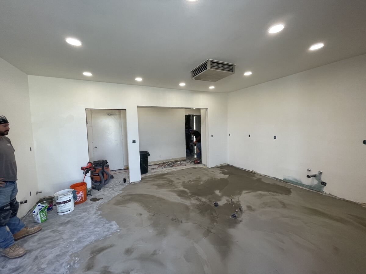 Framing and drywall stage with new ceiling and lighting