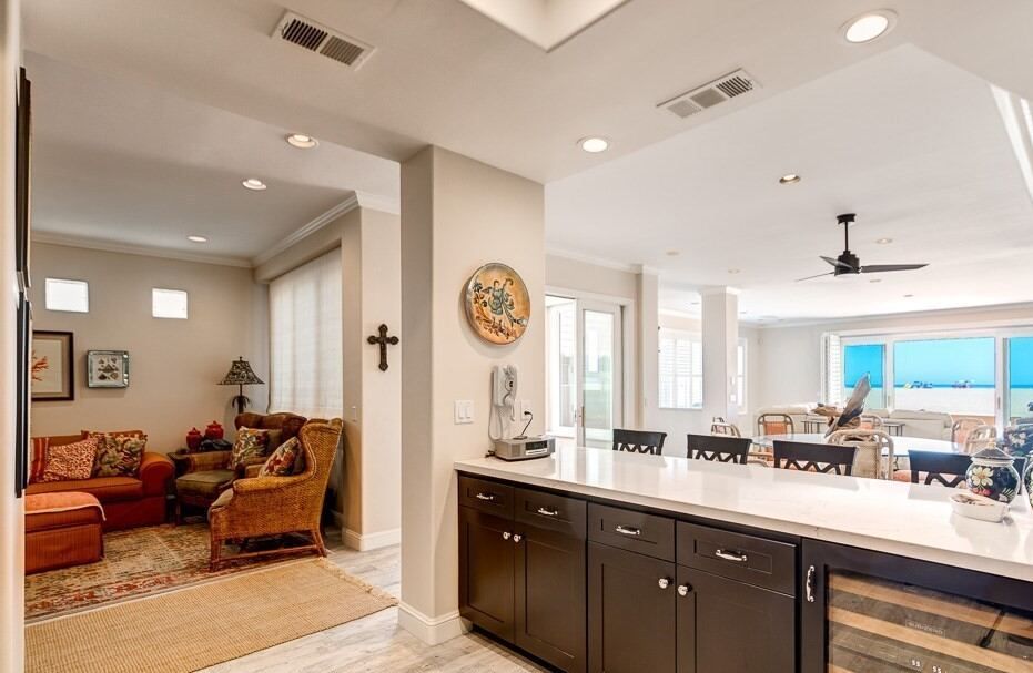 Open living and dining area with the ocean visible through the far windows